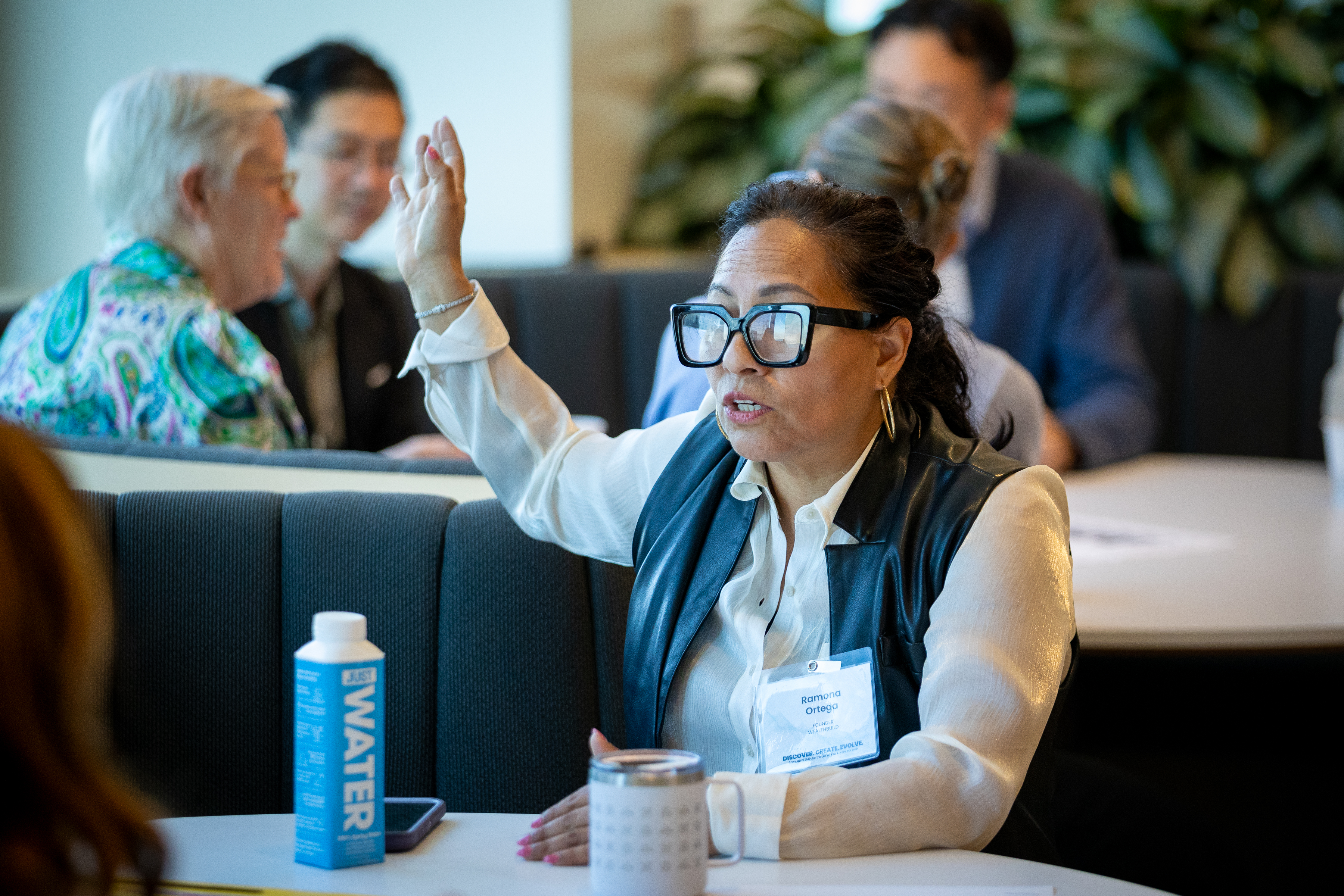 Ramona raising her hand during a discussion